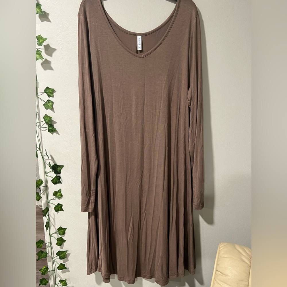 Light brown long sleeve dress with flared bottom